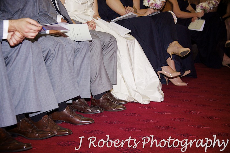 Bridal party sitting in front row of church - wedding photography sydney